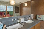 Quartz stone vanities in master bathroom